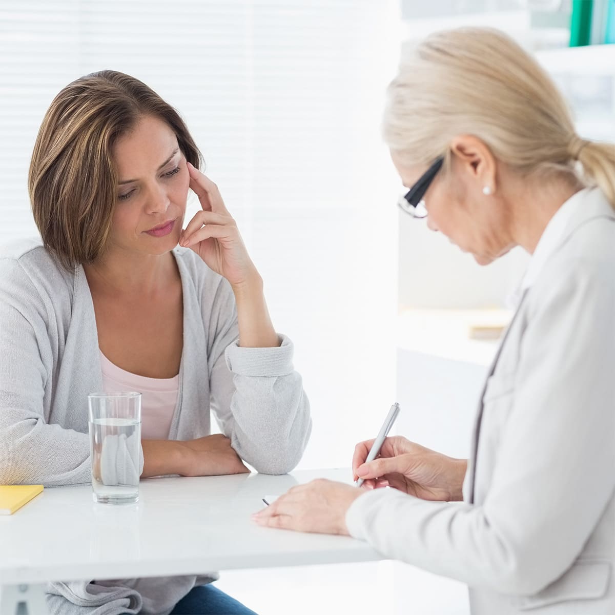 Therapist writing notes